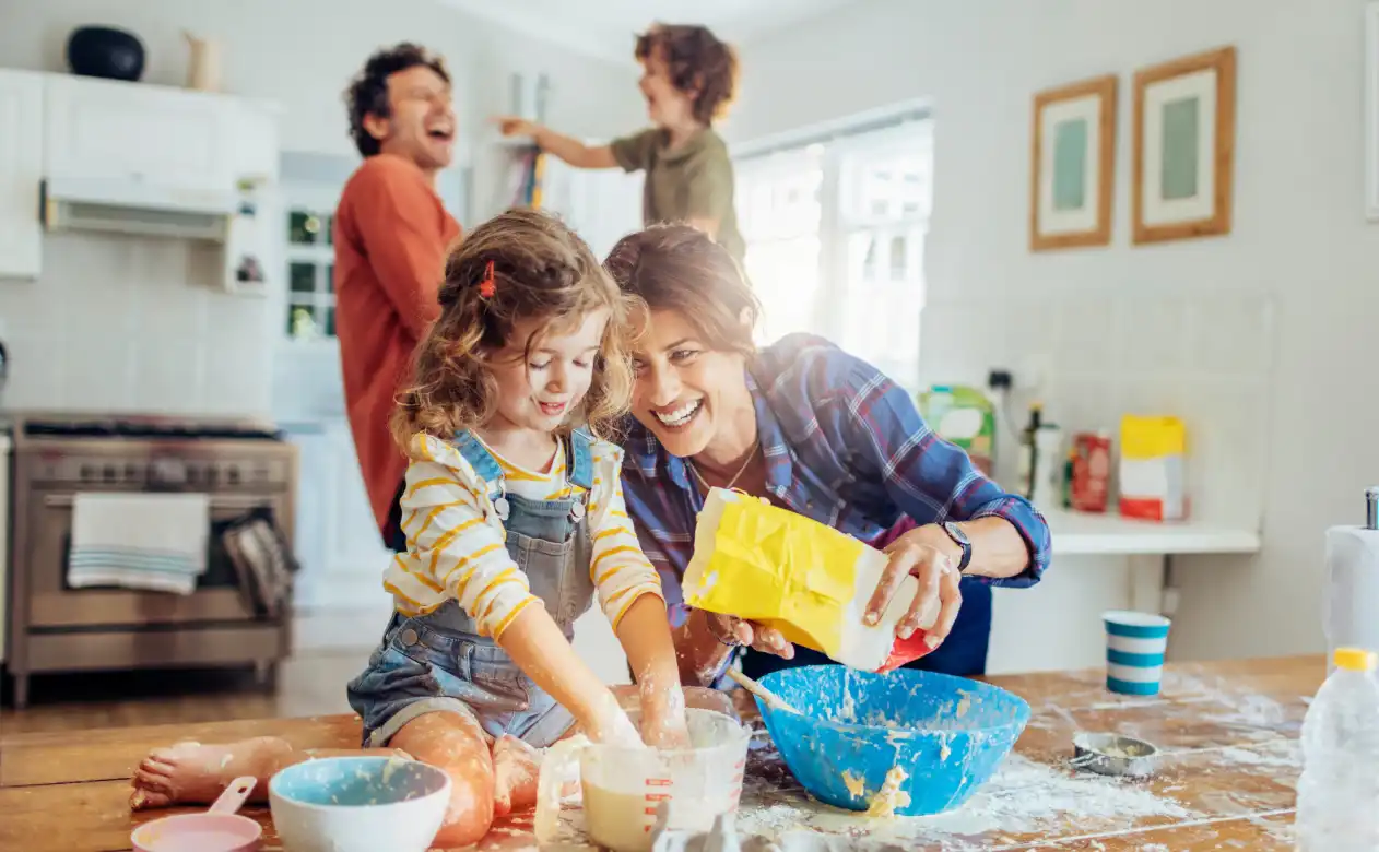 Family making messy baking project. 