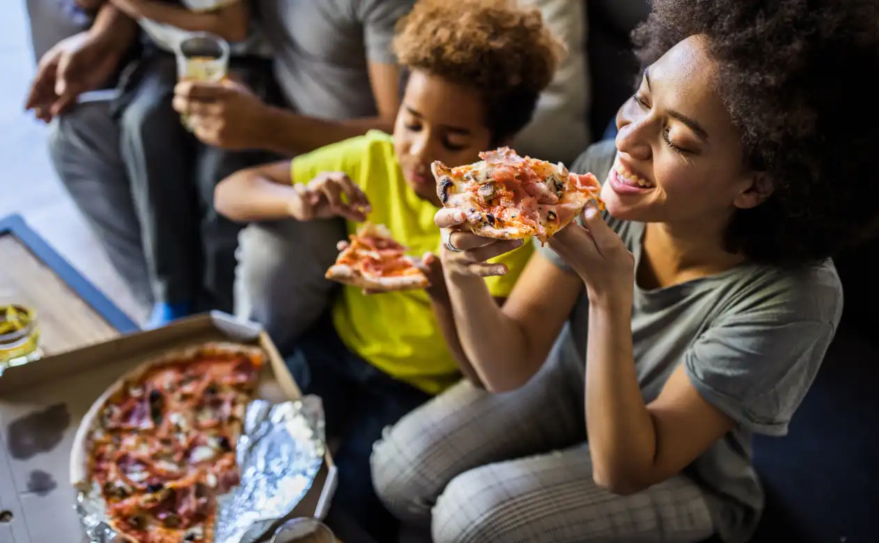 Family pizza night gathering. 